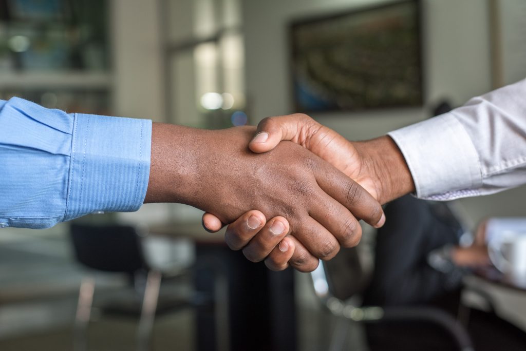 Two men shaking hands after finding a job at freerecruit.co.za