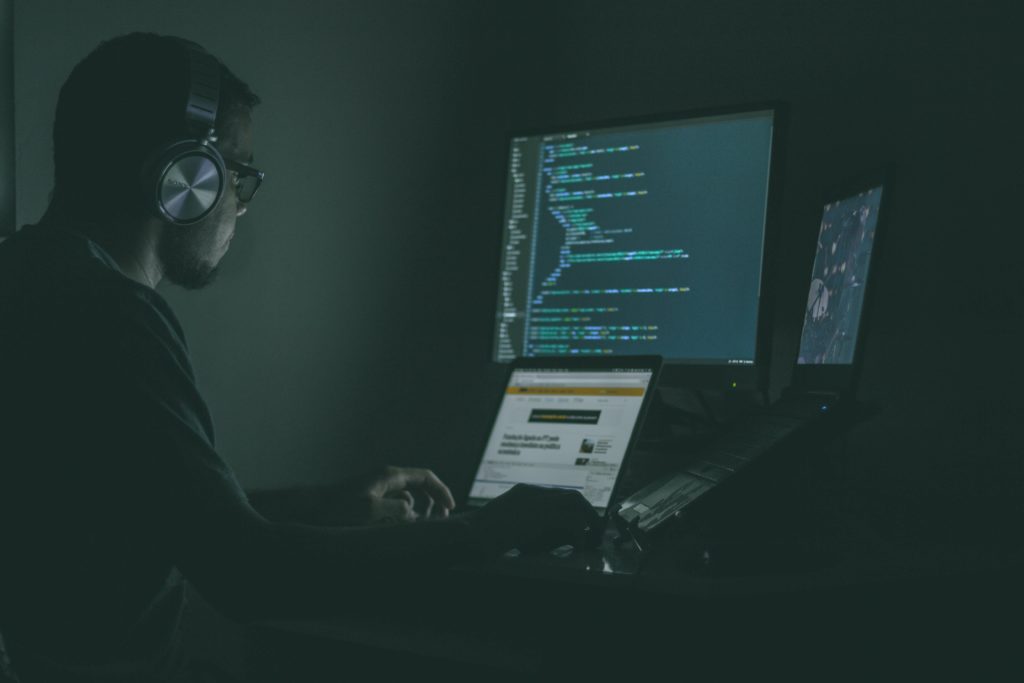 Blockchain developer working on his computer.